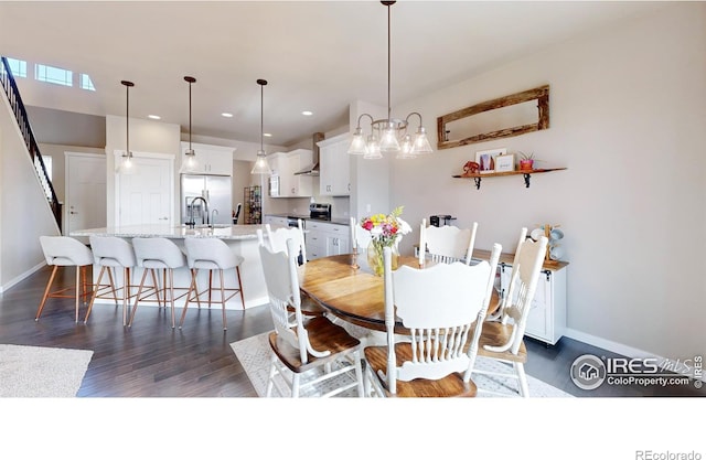 dining area with baseboards, dark wood-style flooring, and recessed lighting