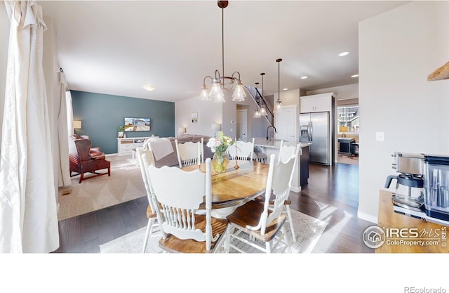 dining room featuring dark wood-style floors, baseboards, and recessed lighting