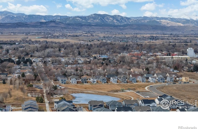 drone / aerial view featuring a residential view and a mountain view