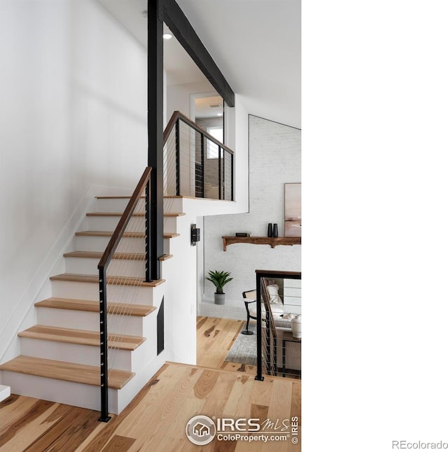 staircase featuring hardwood / wood-style floors