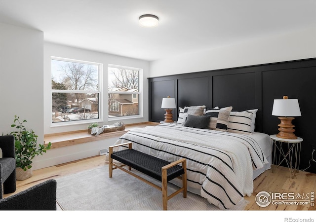 bedroom with light hardwood / wood-style floors