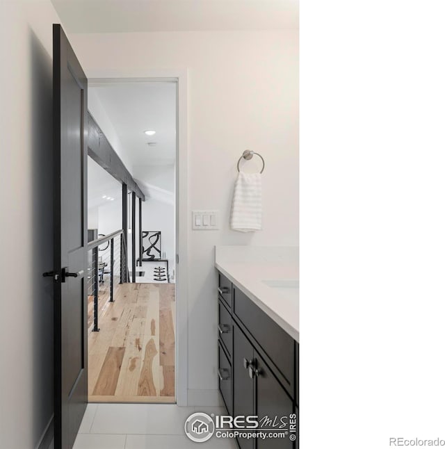 bathroom featuring hardwood / wood-style floors and vanity