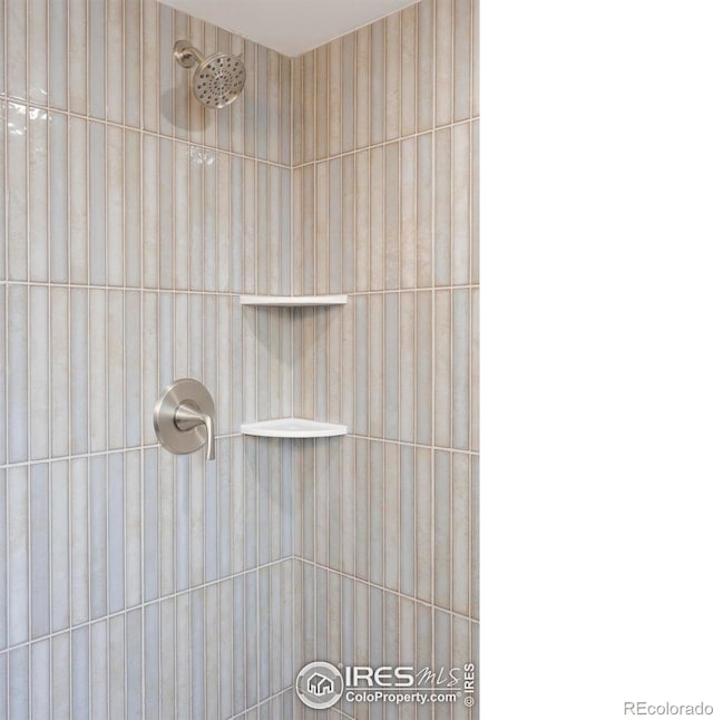 bathroom with a tile shower