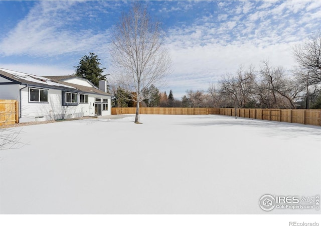 view of yard covered in snow