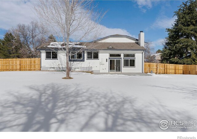 view of snow covered house