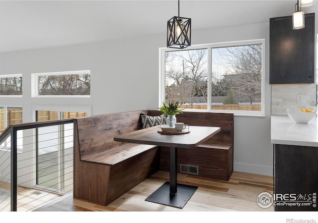 dining space featuring light hardwood / wood-style flooring and breakfast area