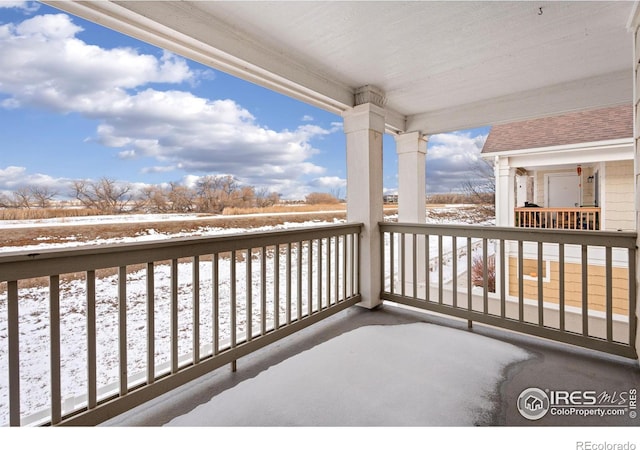 view of snow covered deck