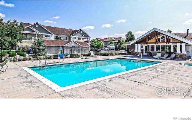 view of swimming pool featuring a patio