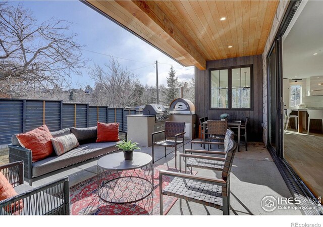 view of patio featuring area for grilling and outdoor lounge area