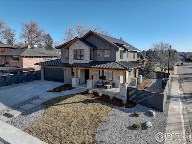 view of front of home with a garage and covered porch