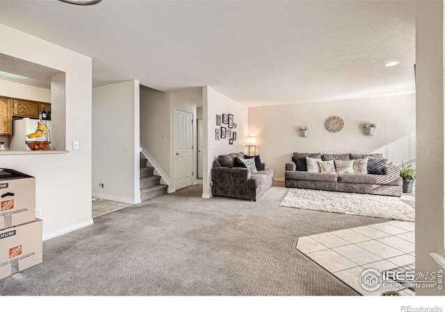 living room with light colored carpet and a textured ceiling