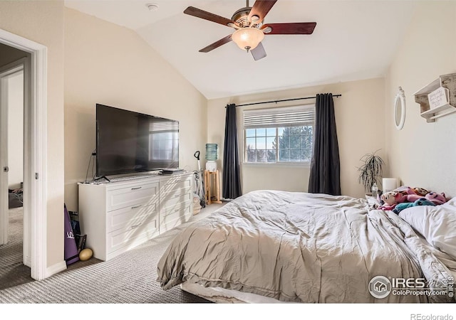 bedroom featuring ceiling fan, vaulted ceiling, and light carpet