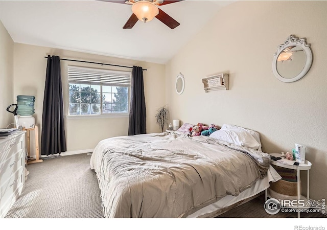 bedroom featuring vaulted ceiling, ceiling fan, and carpet flooring