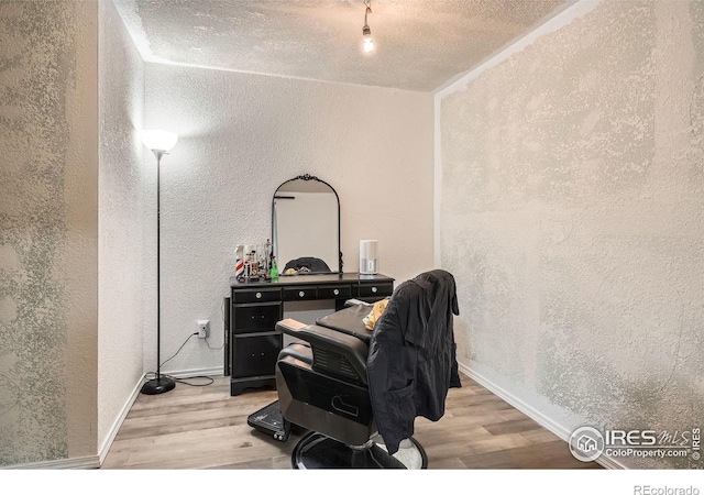 home office with light hardwood / wood-style floors