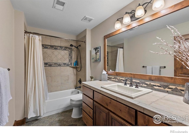 full bathroom featuring vanity, tile patterned floors, shower / bath combination with curtain, and toilet