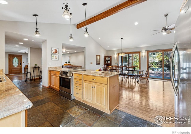 kitchen with light stone countertops, appliances with stainless steel finishes, light brown cabinetry, and hanging light fixtures