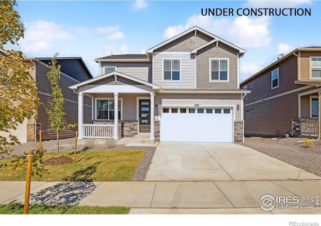 craftsman-style home featuring a porch and a garage