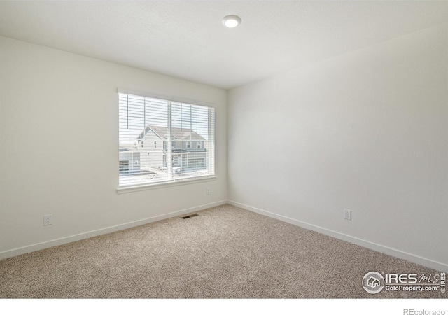 view of carpeted spare room