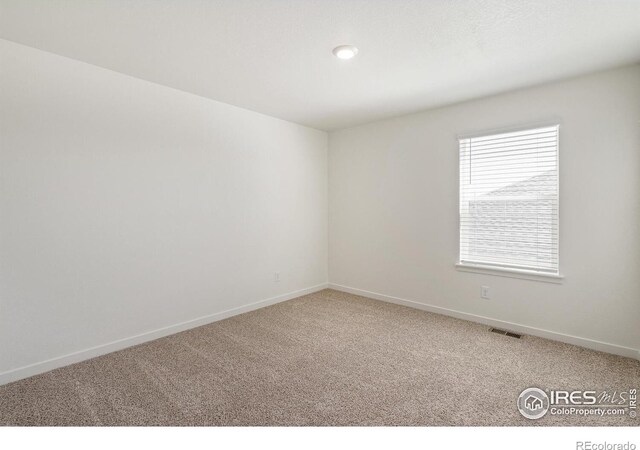 empty room with carpet floors