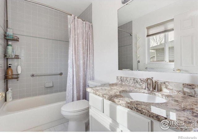 full bathroom featuring vanity, shower / bath combination with curtain, and toilet