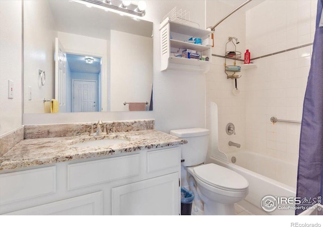 full bathroom with vanity, shower / bath combination with curtain, and toilet