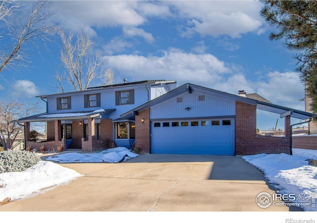 view of front of house with a garage and covered porch