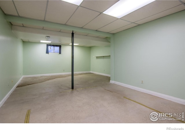 basement featuring a drop ceiling