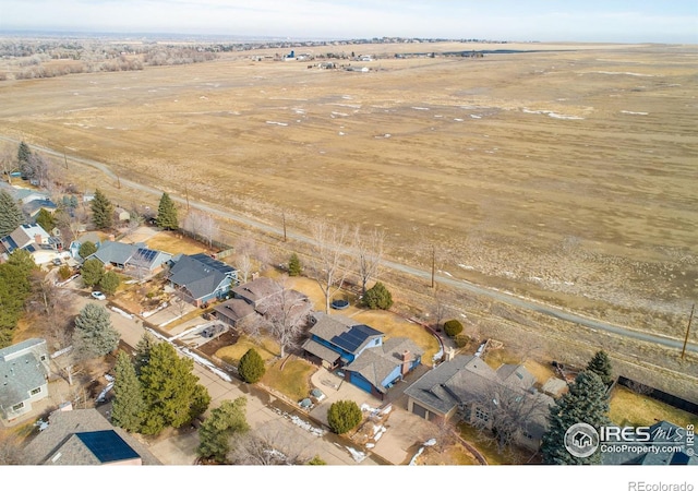 birds eye view of property with a rural view