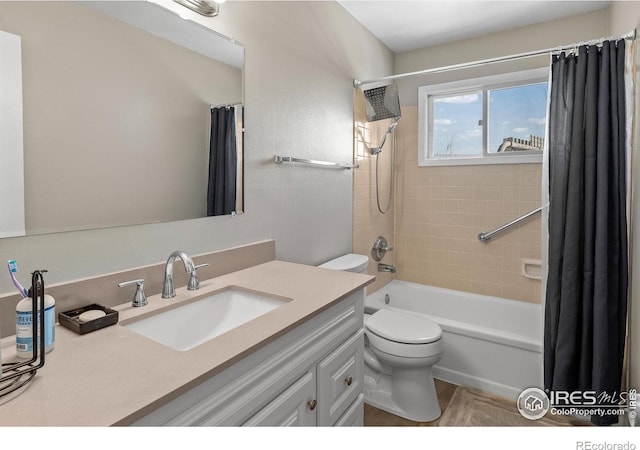 full bathroom with shower / bath combo, vanity, and toilet