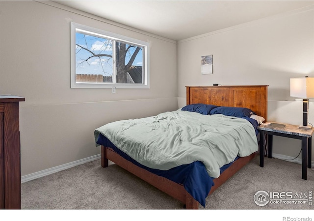 bedroom with light colored carpet