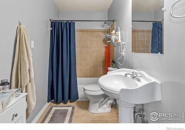 bathroom with toilet, tile patterned flooring, and shower / bath combo