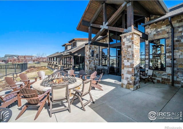 view of patio featuring an outdoor fire pit