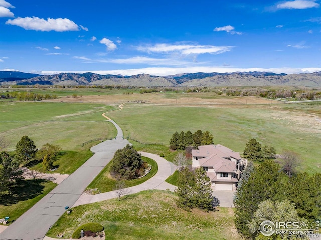 drone / aerial view with a rural view and a mountain view