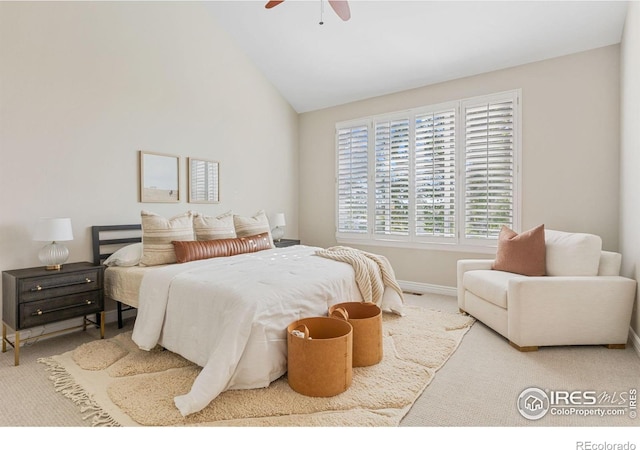 bedroom featuring ceiling fan, vaulted ceiling, and carpet