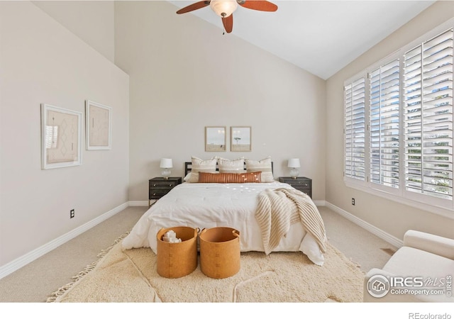 bedroom with high vaulted ceiling, ceiling fan, and carpet flooring