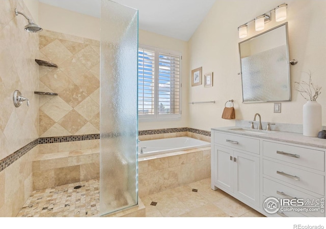 bathroom featuring tile patterned flooring, vanity, and separate shower and tub