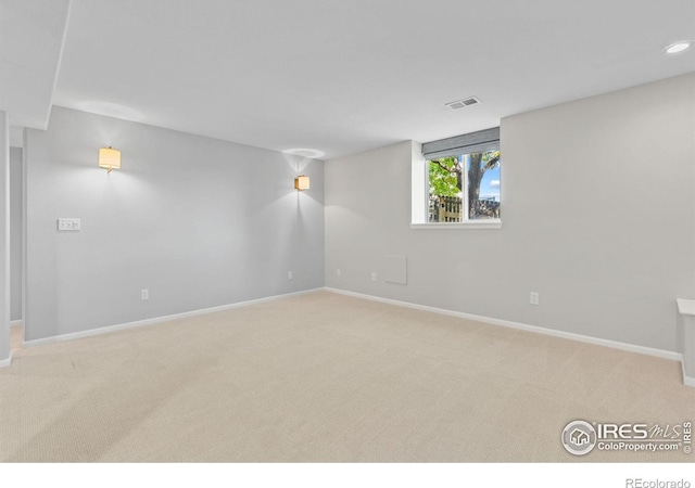 basement with light colored carpet