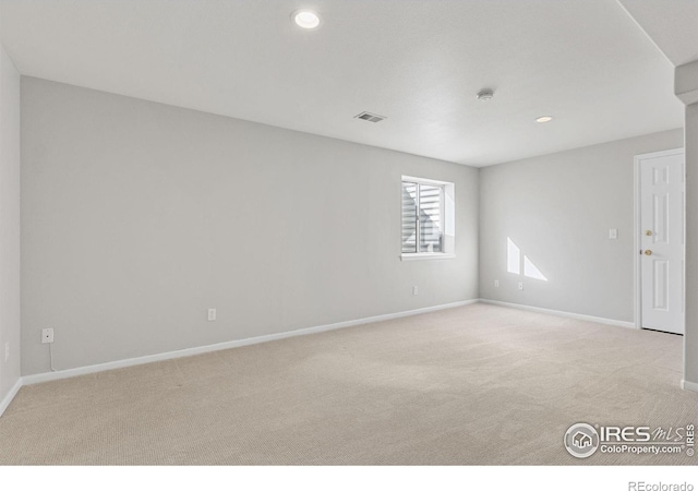 empty room featuring light colored carpet