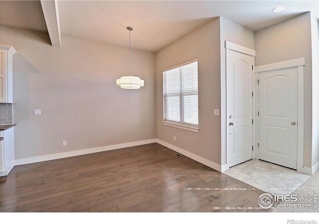 foyer with light hardwood / wood-style floors