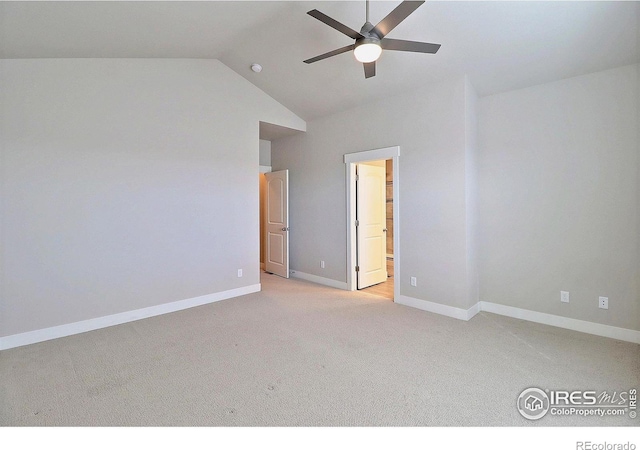 carpeted spare room with high vaulted ceiling and ceiling fan