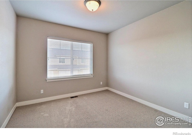 empty room with carpet floors