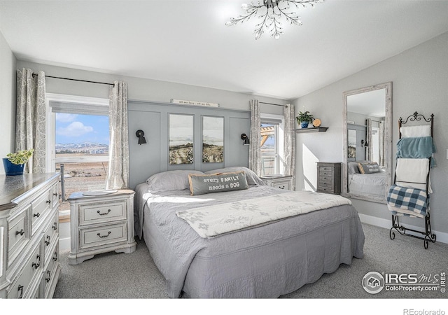 carpeted bedroom with vaulted ceiling