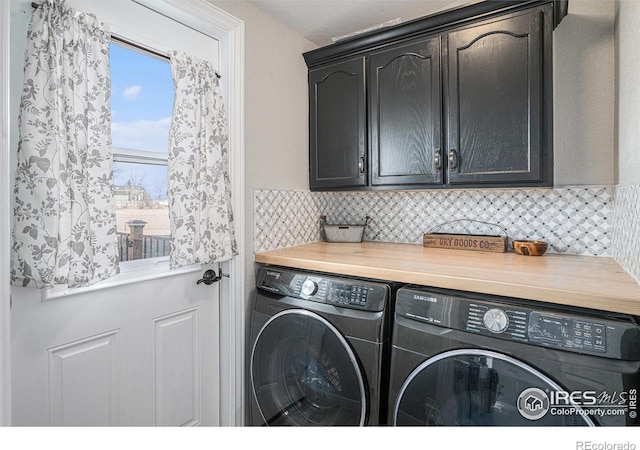 laundry area with cabinets and washer and dryer