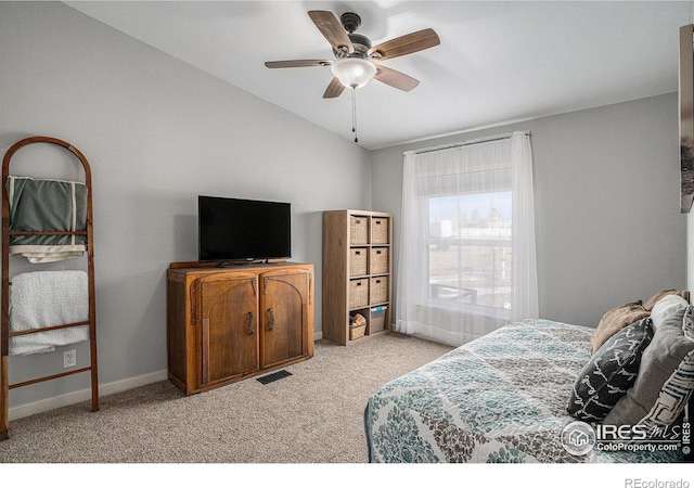 bedroom with light carpet, vaulted ceiling, and ceiling fan