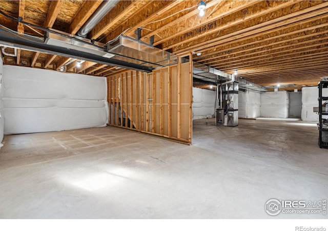 basement featuring heating unit