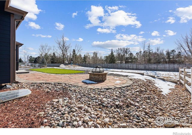 view of yard with an outdoor fire pit and a patio