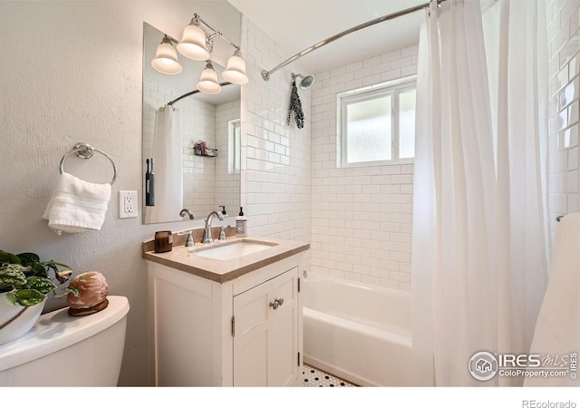 full bathroom with shower / bathtub combination with curtain, vanity, and toilet