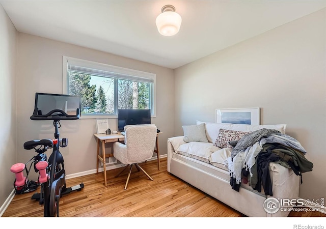 office area with light hardwood / wood-style floors