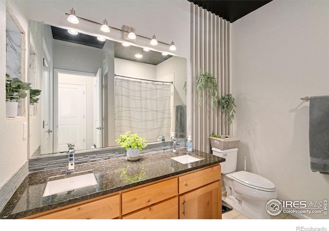 bathroom featuring vanity, a shower with shower curtain, tile patterned floors, and toilet