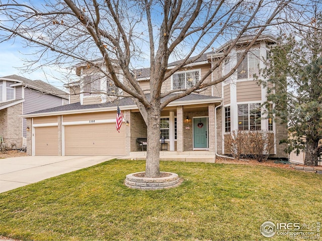 view of front property with a garage and a front yard